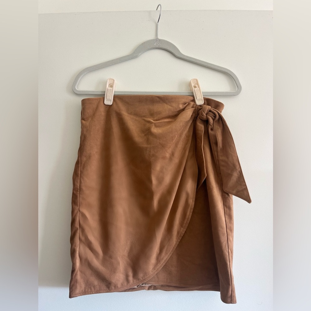 Suede look/feel wrap skirt with bow detail.